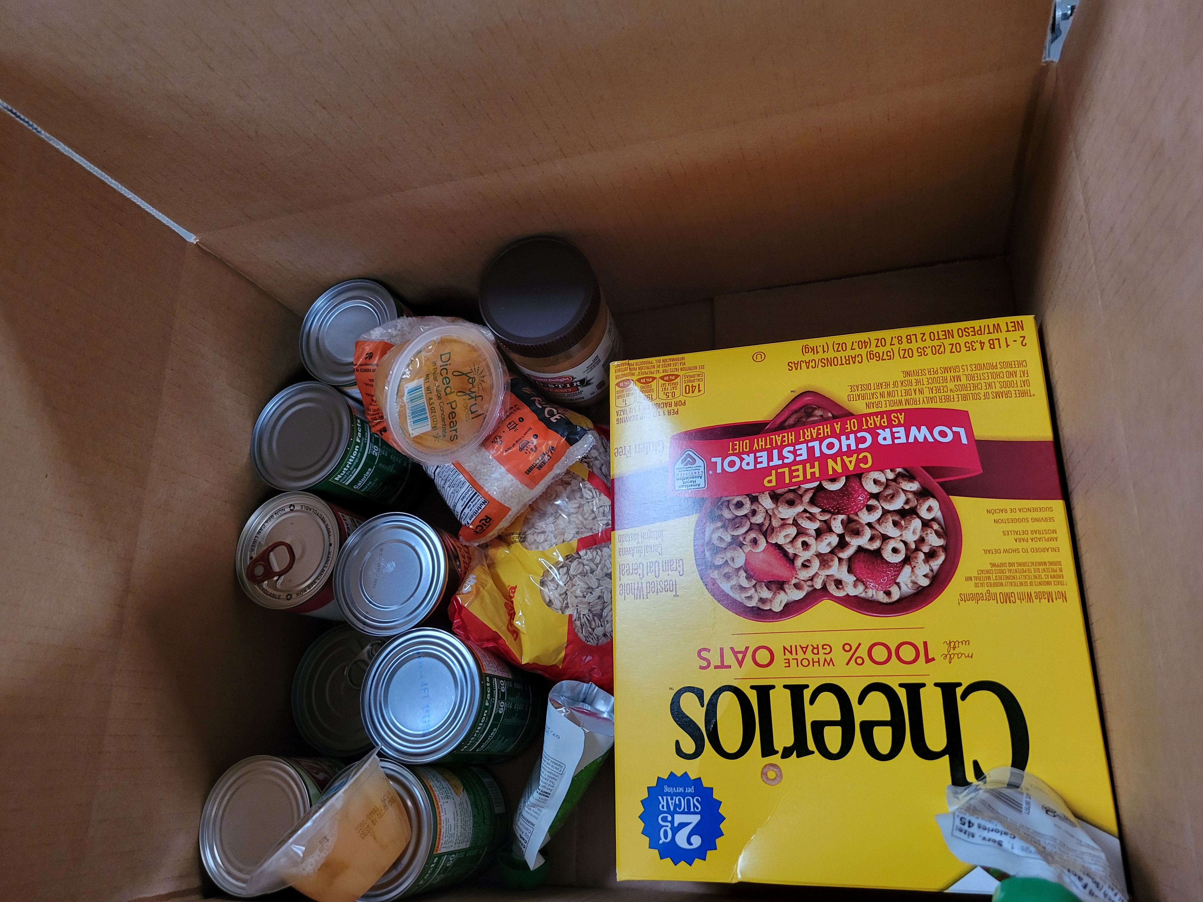 Cardboard box filled with dry goods.